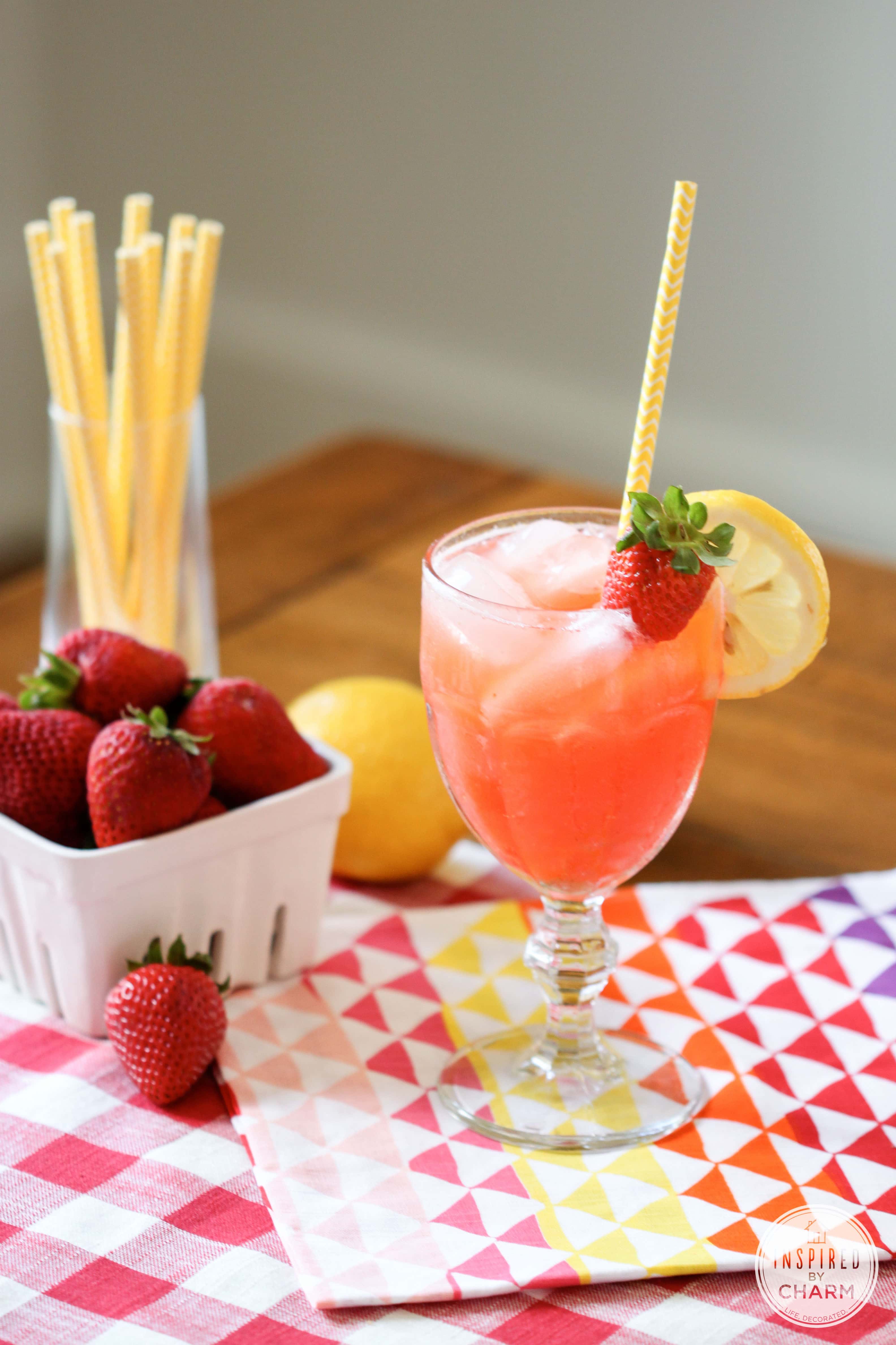 strawberry lemonade cocktail in a pretty glass