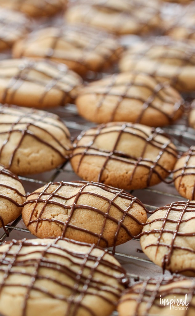stuffed peanut butter cookies on a cooling rack.