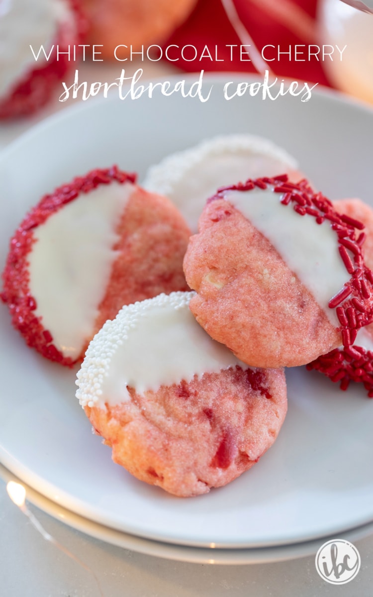 Pink cherry shortbread cookies with white icing on half the cookie