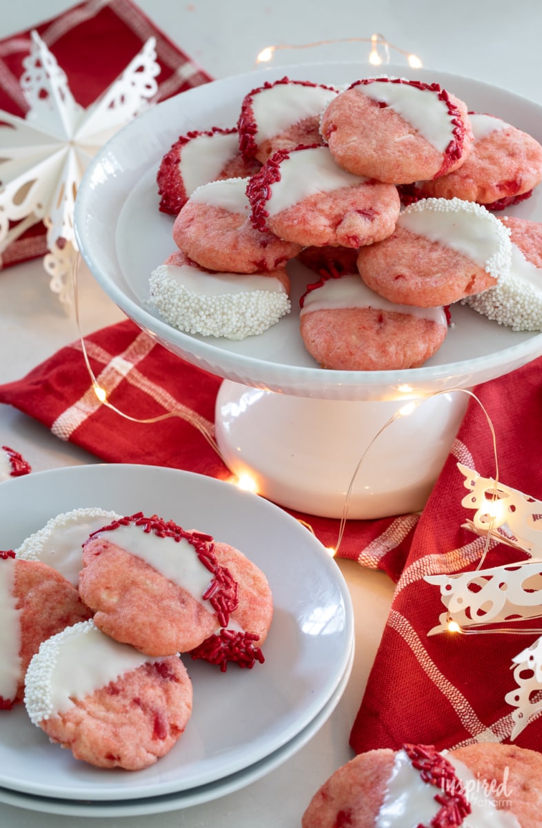 cake stand filled with pink christmas cookies made with cherry