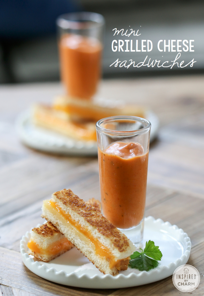 shot glass with tomato basil soup served with mini grilled cheese.