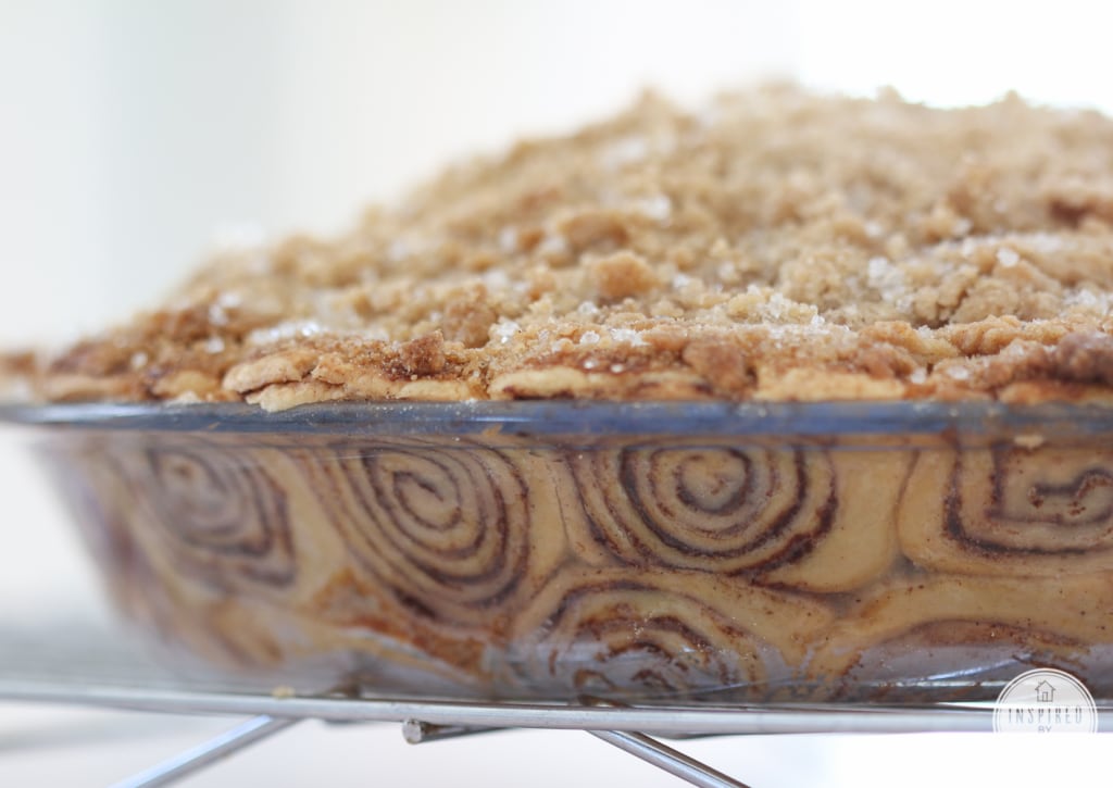 close up of a baking dish filled with apple pie with a cinnamon roll crust