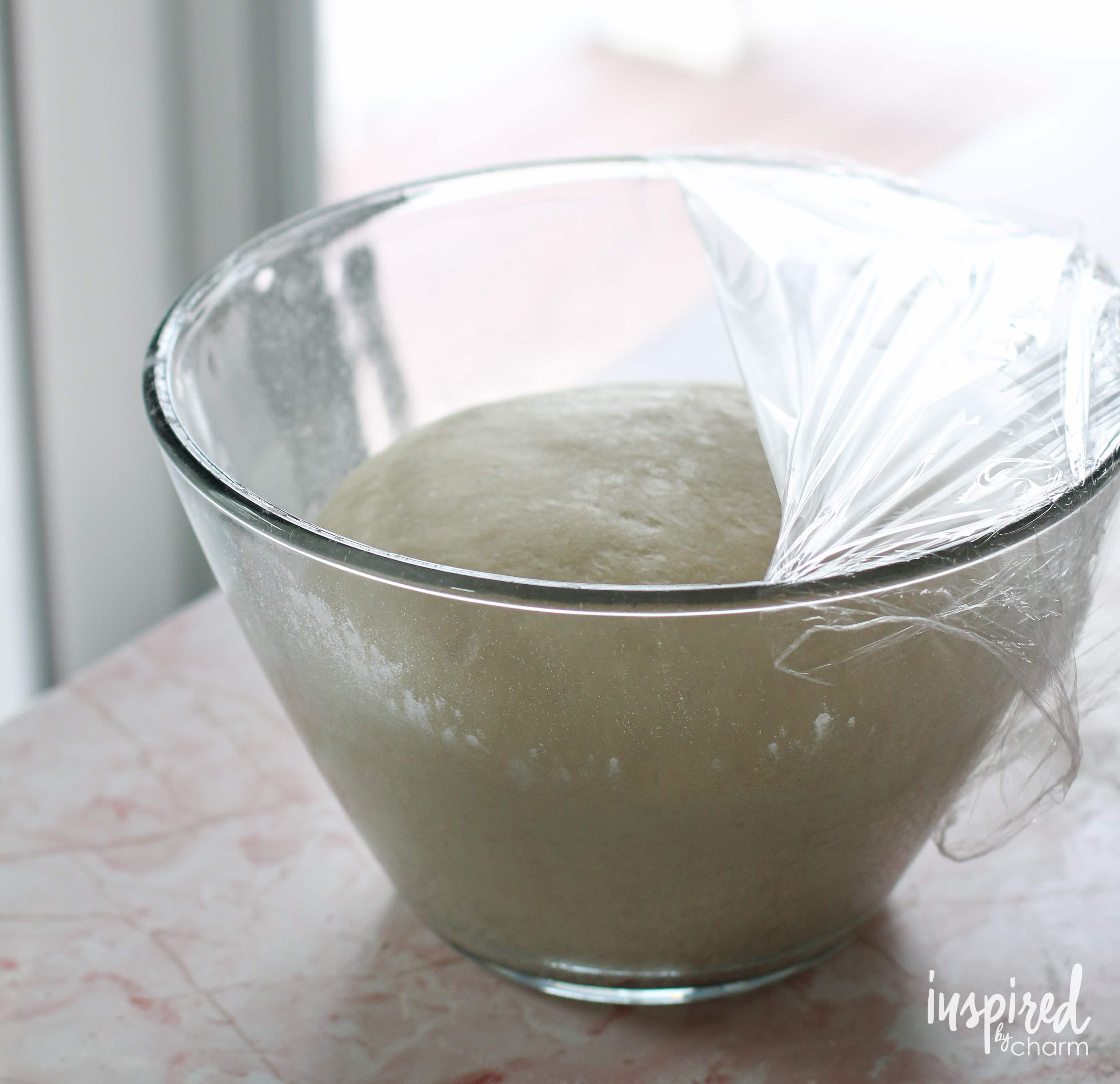 Cinnamon Roll Skillet Bread dough rising in a bowl.