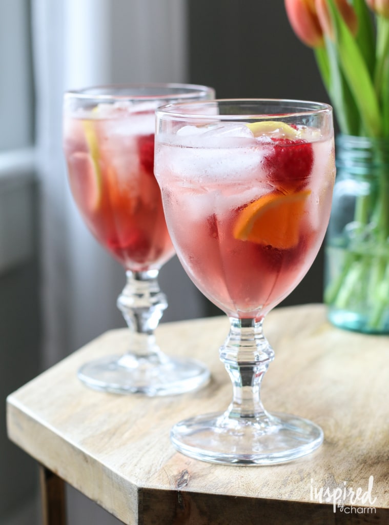 two glasses of rosé sangria on a table.
