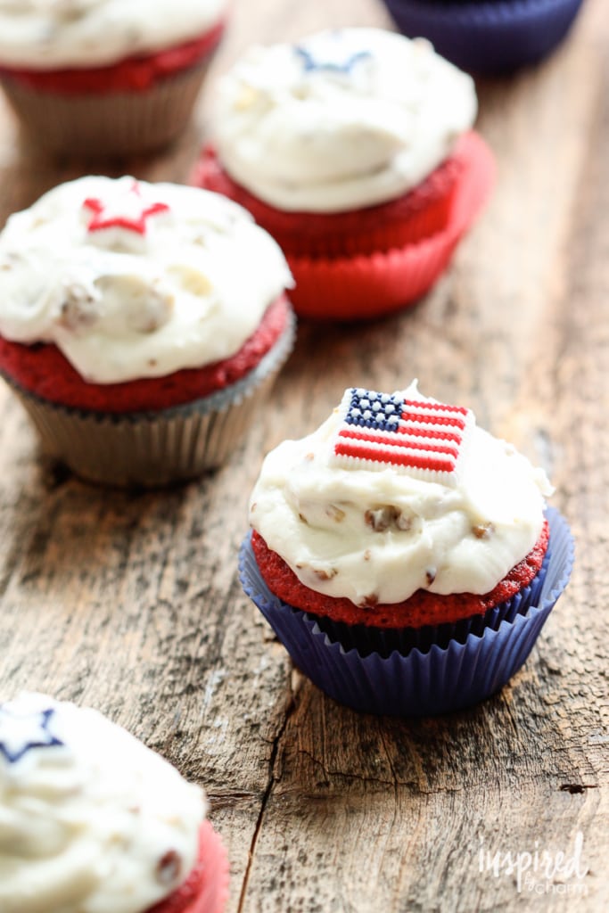 Red Velvet Cupcakes with cream cheese frosting topped with patriotic sugar candies.