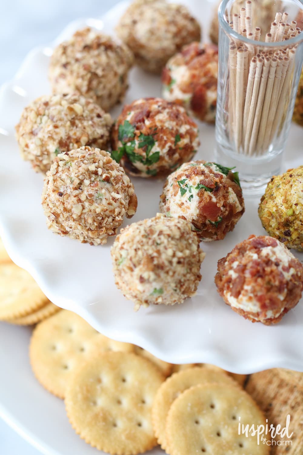 mini cheese balls served with toothpicks on a plate. 
