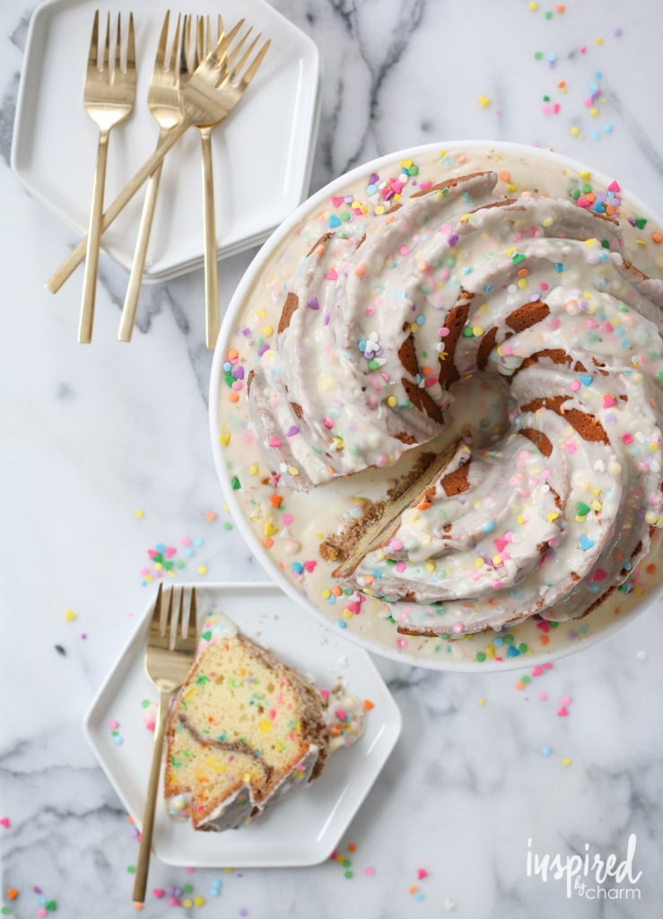 Funfetti Coffee Cake on a cake stand and plates.