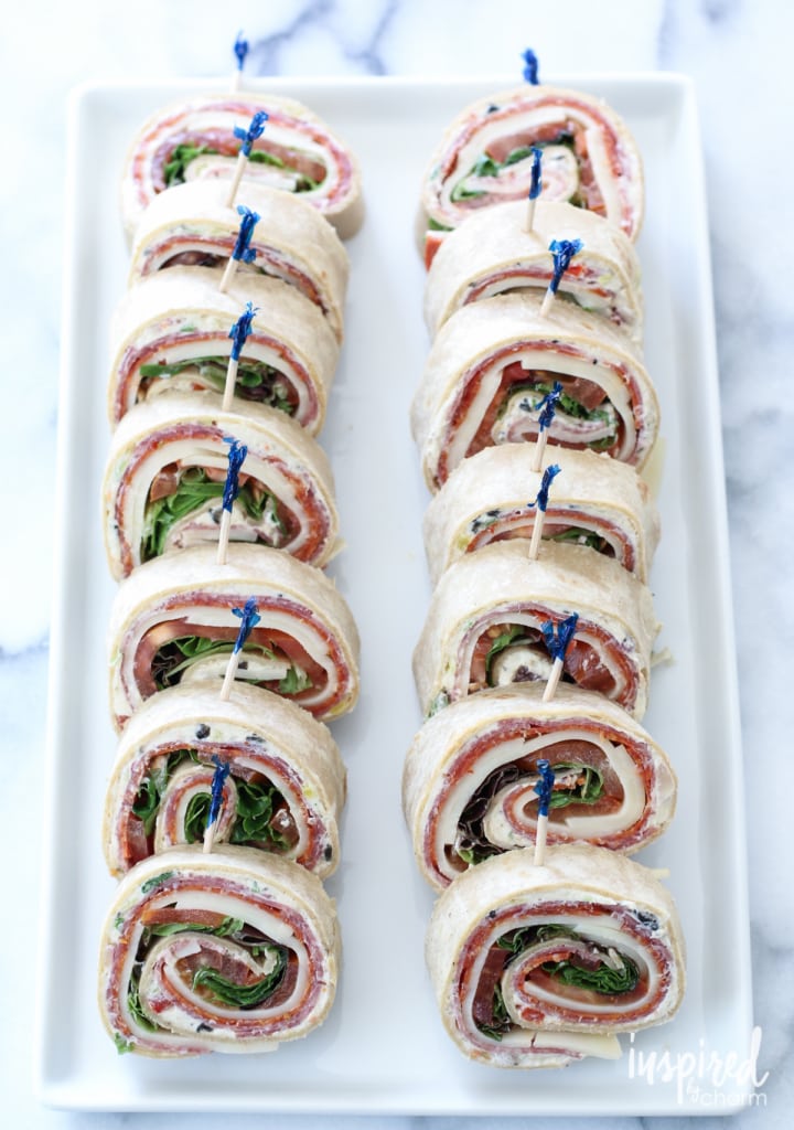 Italian Sub Pinwheel Sandwiches  on a white platter.