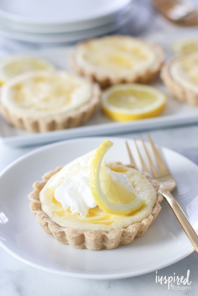 close up of a mini tart filled with lemon curd