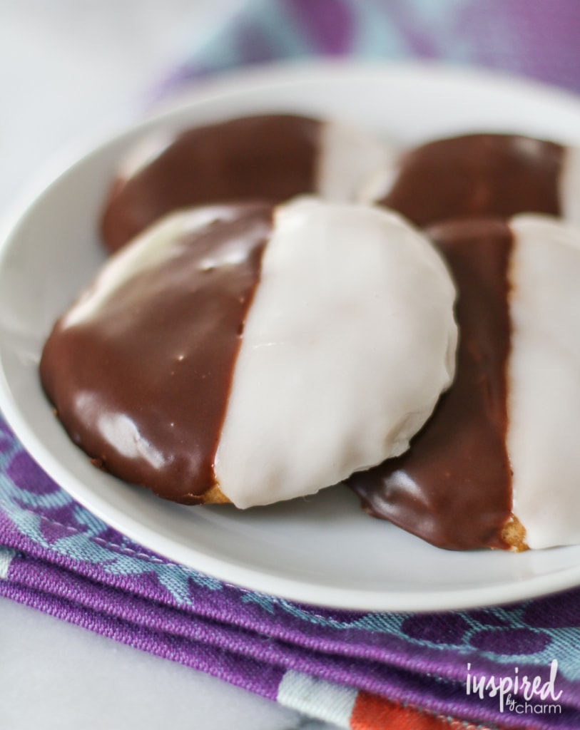 Black and White Pumpkin Cookies on a plate on top of a napkin. 