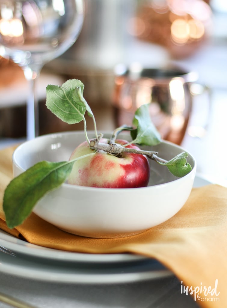 apple with leaves in a bowl