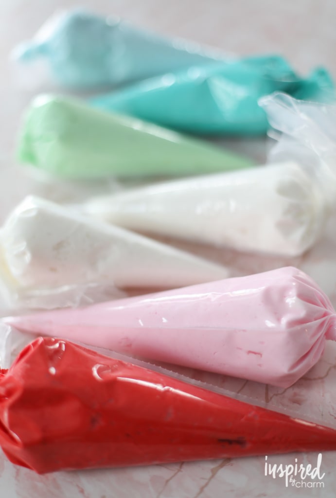 colored buttercream frosting in piping bags