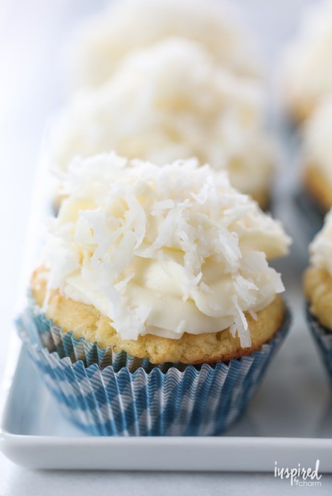 The Ultimate Coconut Cupcakes on a plate.