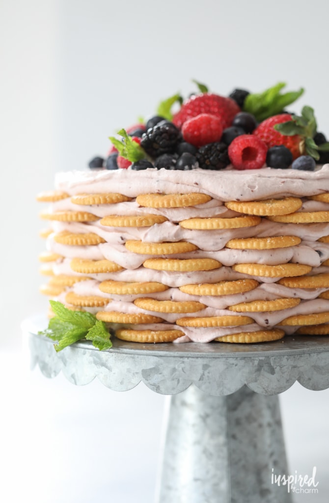 Ritz Cracker and Mixed Berry Icebox Cake on a galvanized metal cake stand.