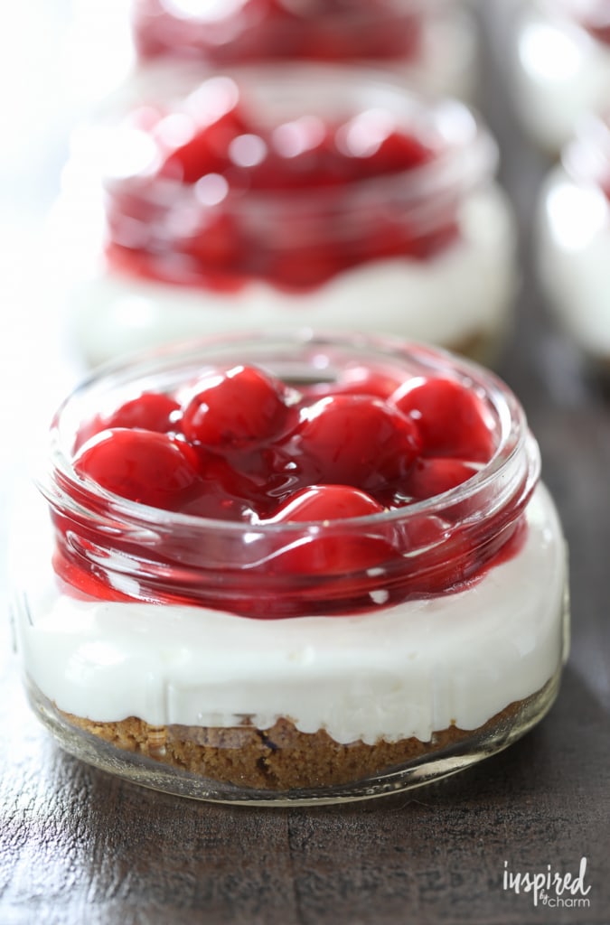 Learn How to Make Cherry Delight in Mason Jars. You'll love this classic dessert recipe. #cherry #delight #dessert #recipe #masonjar #cherries #grahamcrackers #easy #dreamwhip #summer