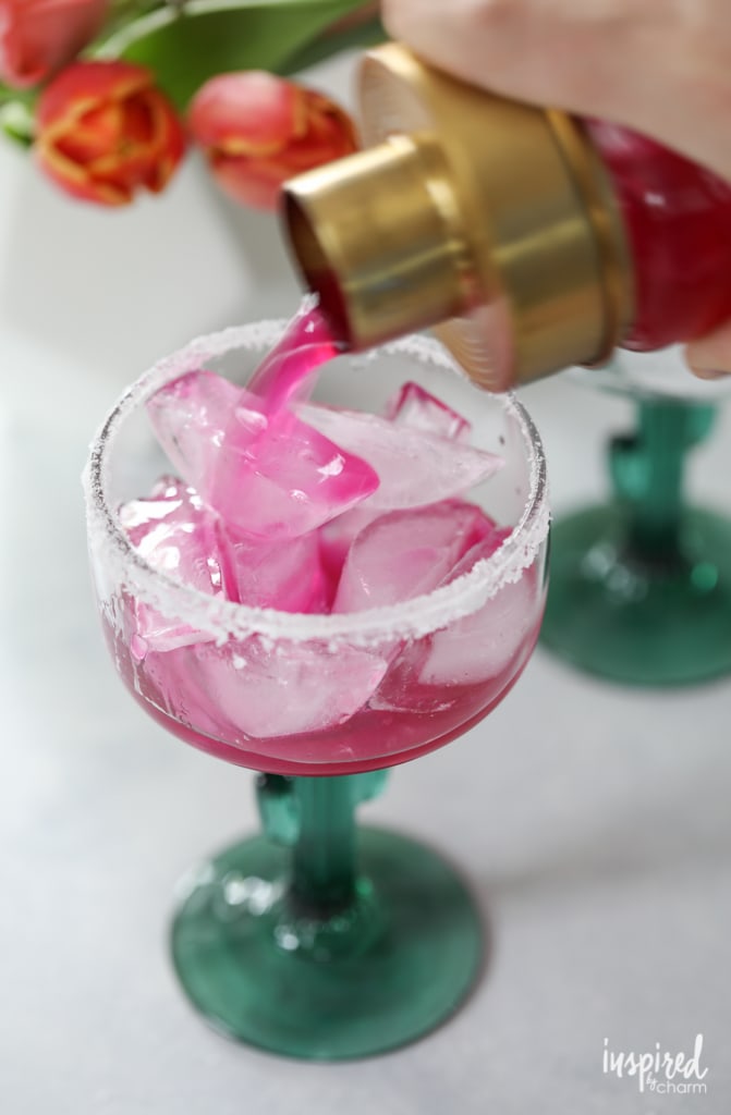 pink prickly pear juice pouring into a glass