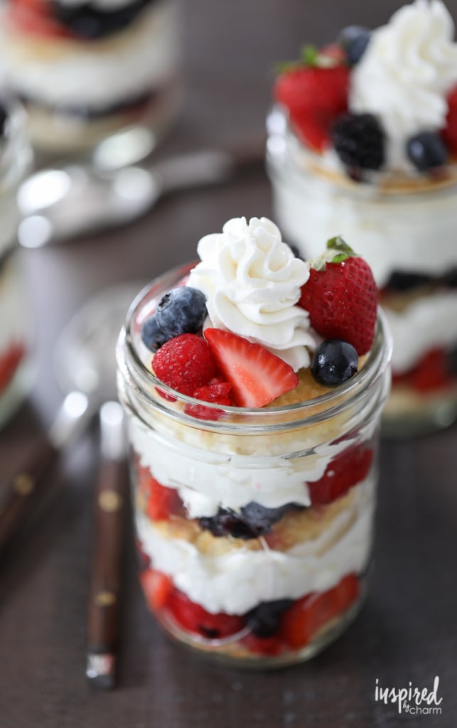 Mixed Berry Shortcakes with Homemade Whipped Cream in jars.