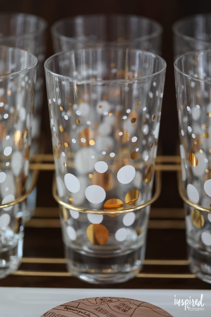 close up of vintage glassware with white and gold polka dots.