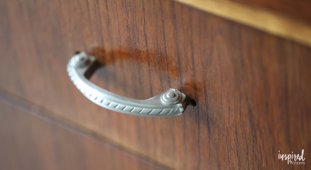 Tips for updating a thrifted mid-centruy sideboard with new drawer pulls. | Inspired by Charm