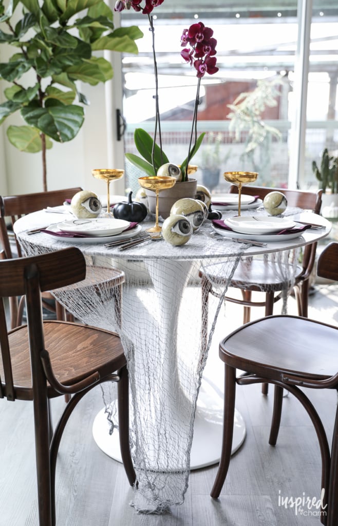 Wicked and Eclectic Halloween Table Setting - spooky chic tablescape decor ideas