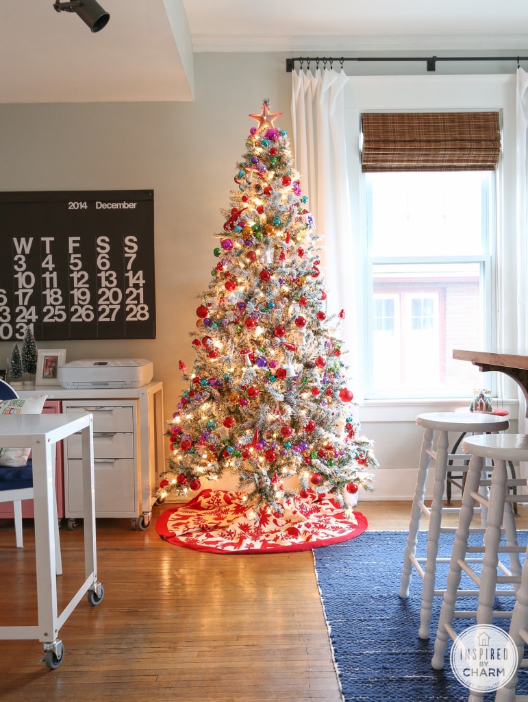 flocked tree from Walmart with colorful ornament garland