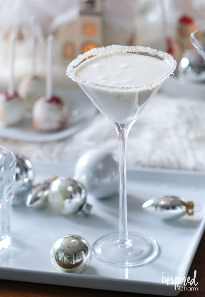 white Christmas martini drink in a tall stemmed glass
