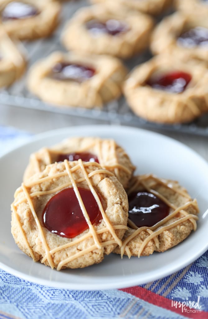 A classic flavor combination in cookie from - Peanut Butter and Jelly Thumbprint Cookies #peanutbutter #jelly #cookie #recipe 