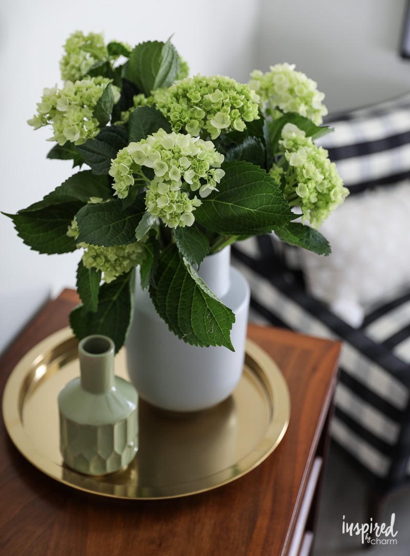 vase of hydrangea on a dresser. 