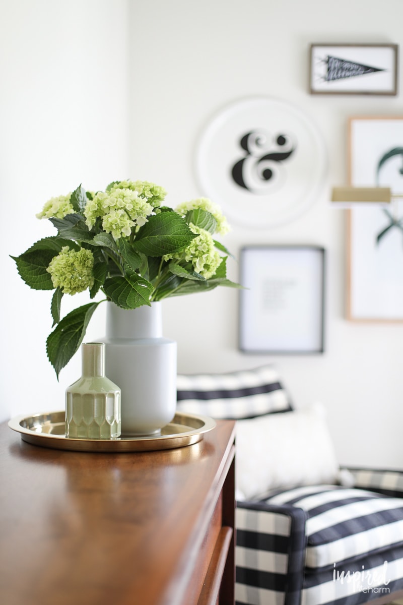 vase of hydrangea on a dresser.
