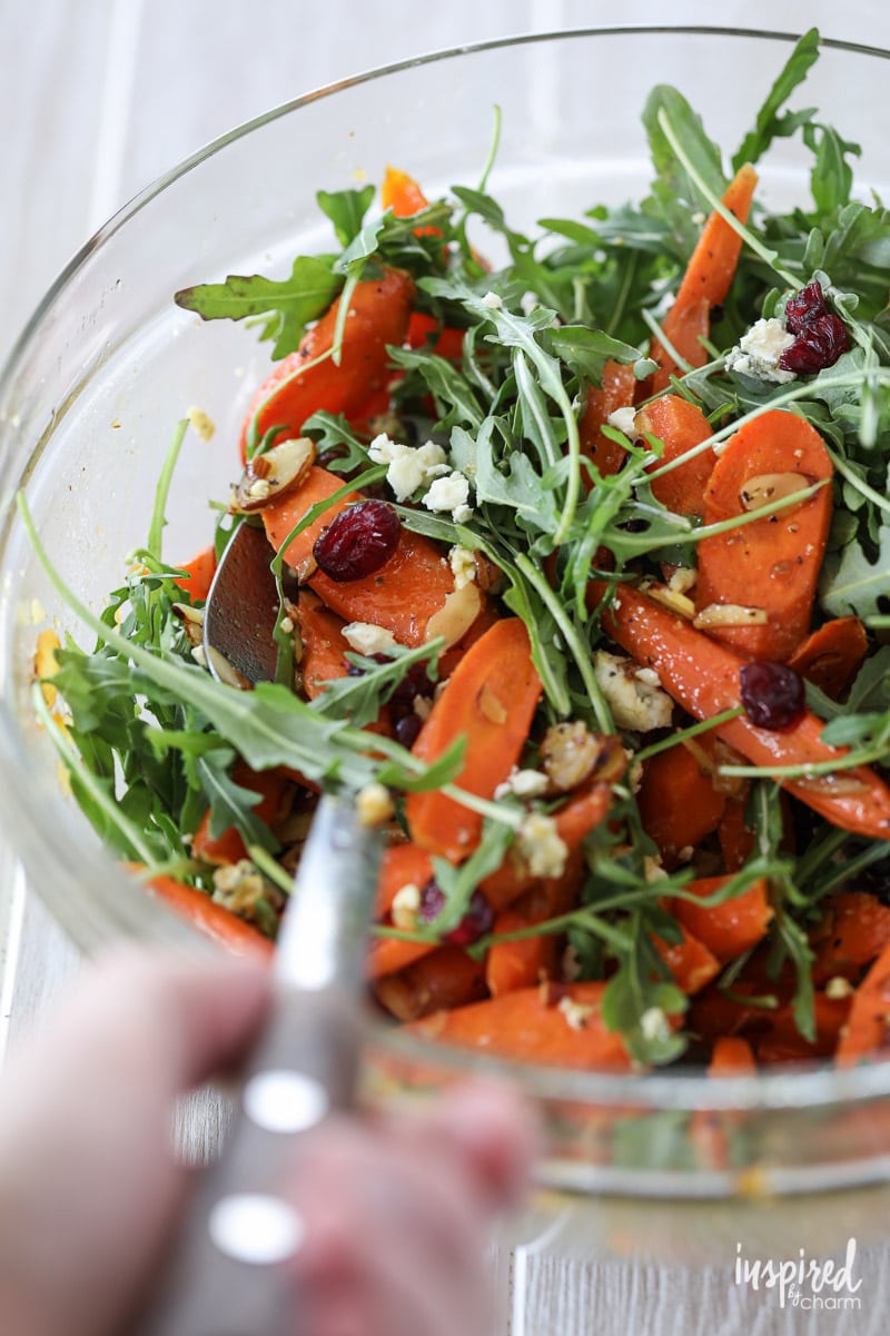 Learn how to make this delicious roasted #carrot #salad #recipe with arugula, blue cheese, dried cranberries, and almonds. 