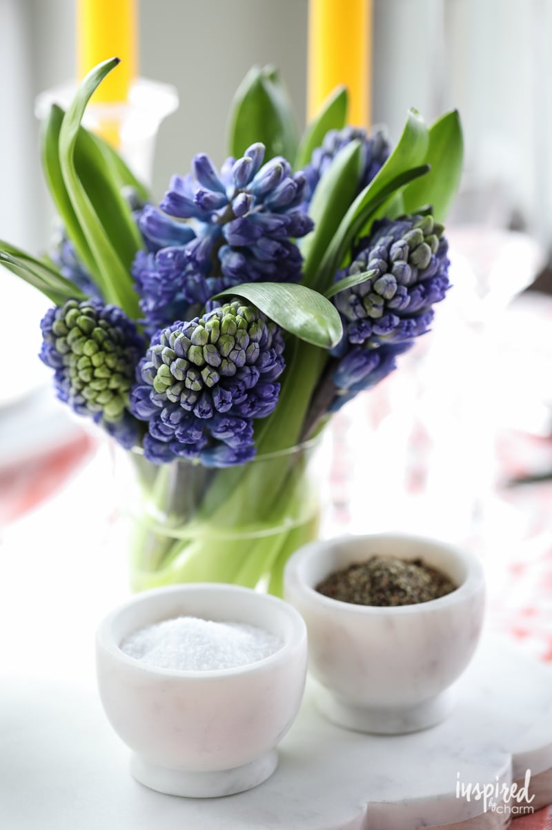 mini vase of flowers on a table.