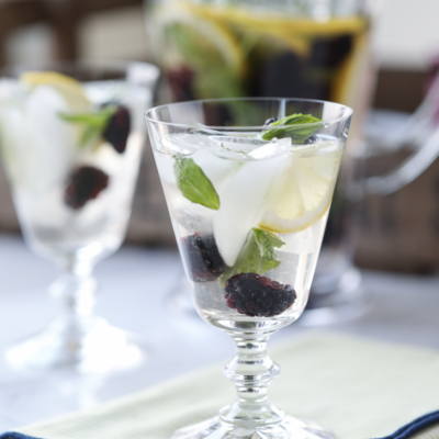The flavors of fresh basil, ripe blackberries, and refreshing lemon blend together beautifully in this Blackberry Basil #Sangria #recipe.