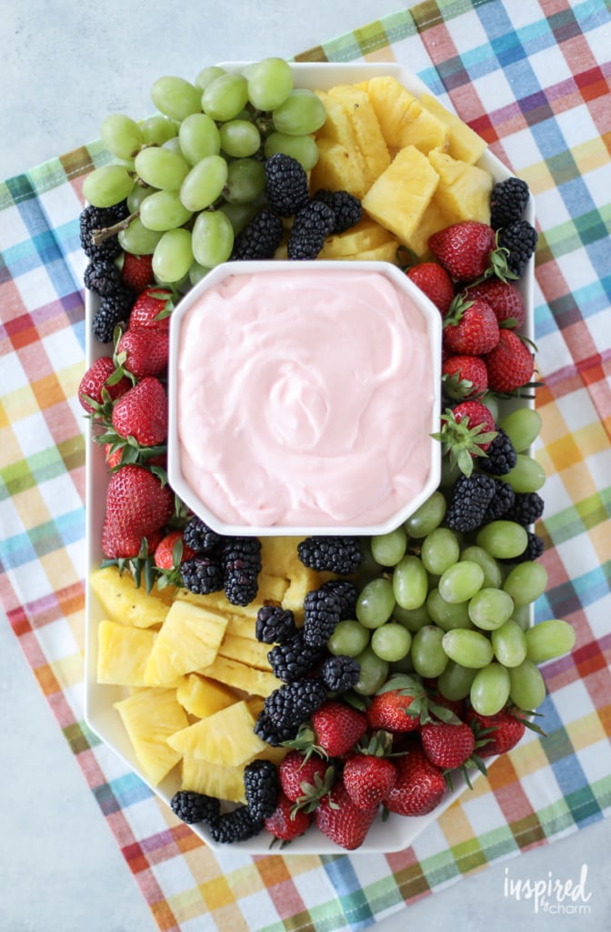 platter of fruit with pink dip in the center