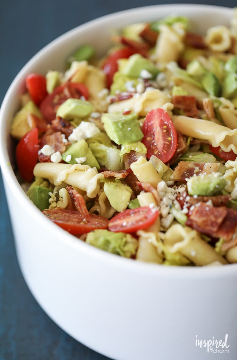 This California Cobb Pasta Salad Recipe with bacon, avocado, blue cheese, romaine, and tomatoes is perfect for summer entertaining! #pasta #salad #recipe #appetizer