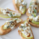 This Blue Cheese, Pear, and Honey Crostini make a flavorful and easy appetizer. #appetizer #crostini #bluecheese #pear #honey #recipe