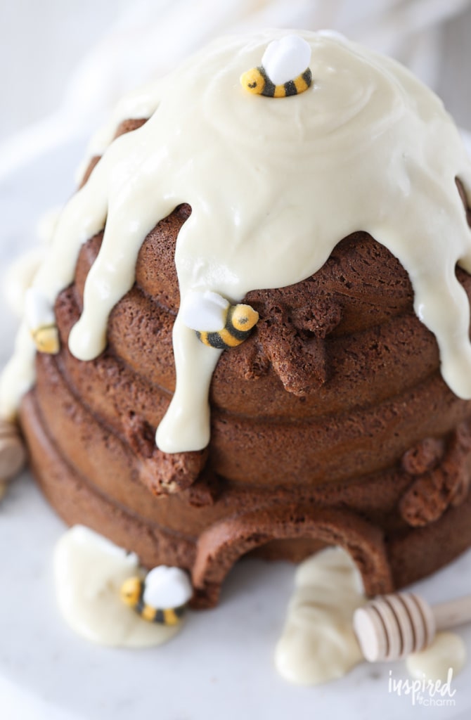 Close up of a honey bundt cake with sugar bees