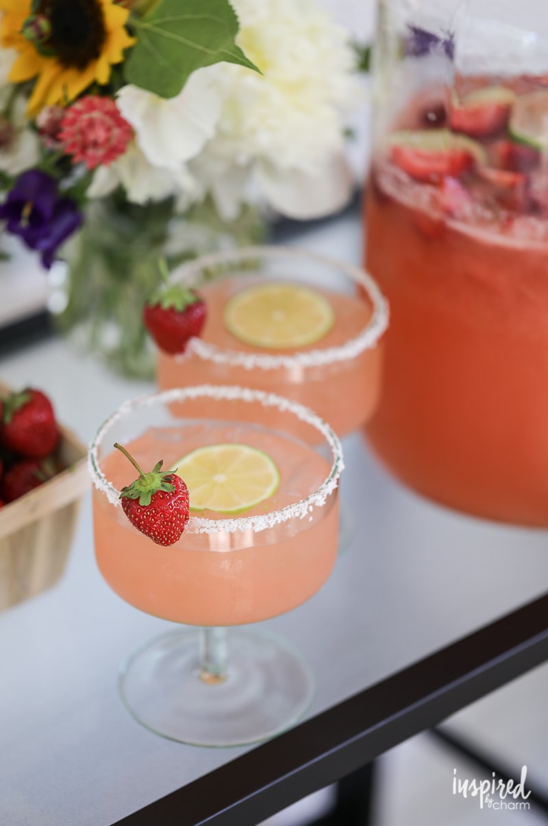 Delicious and Easy Strawberry Margarita Punch in glasses and large glass jar.