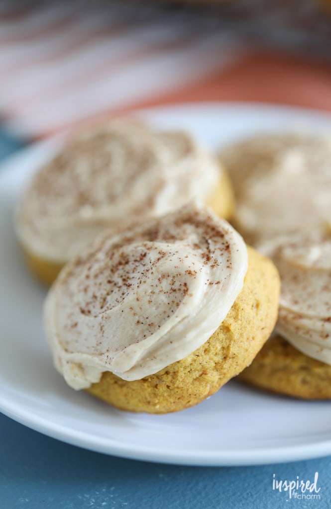 cream cheese frosting and cinnamon atop pumpkin cookies