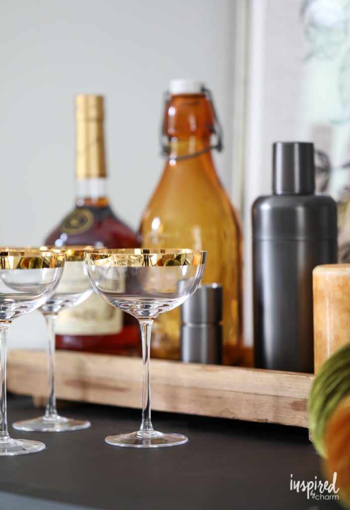 bottles and long stem glasses on a table