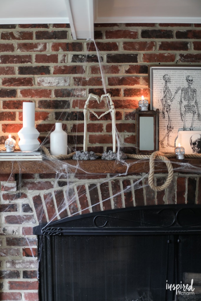 skeleton arms with hands making a heart shape for spooky halloween home decor ideas