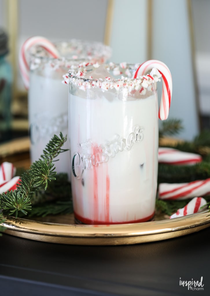 Peppermint garnished cocktail on a gold tray