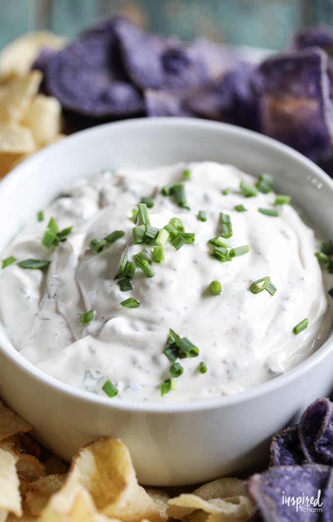 Creamy chip dip topped with fresh scallions