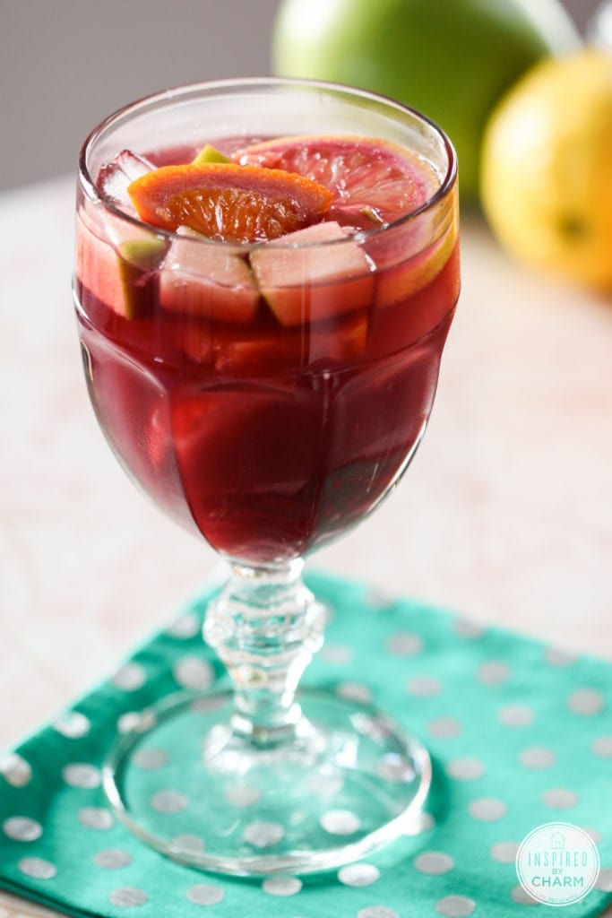 glass of red wine sangria served with fruit.