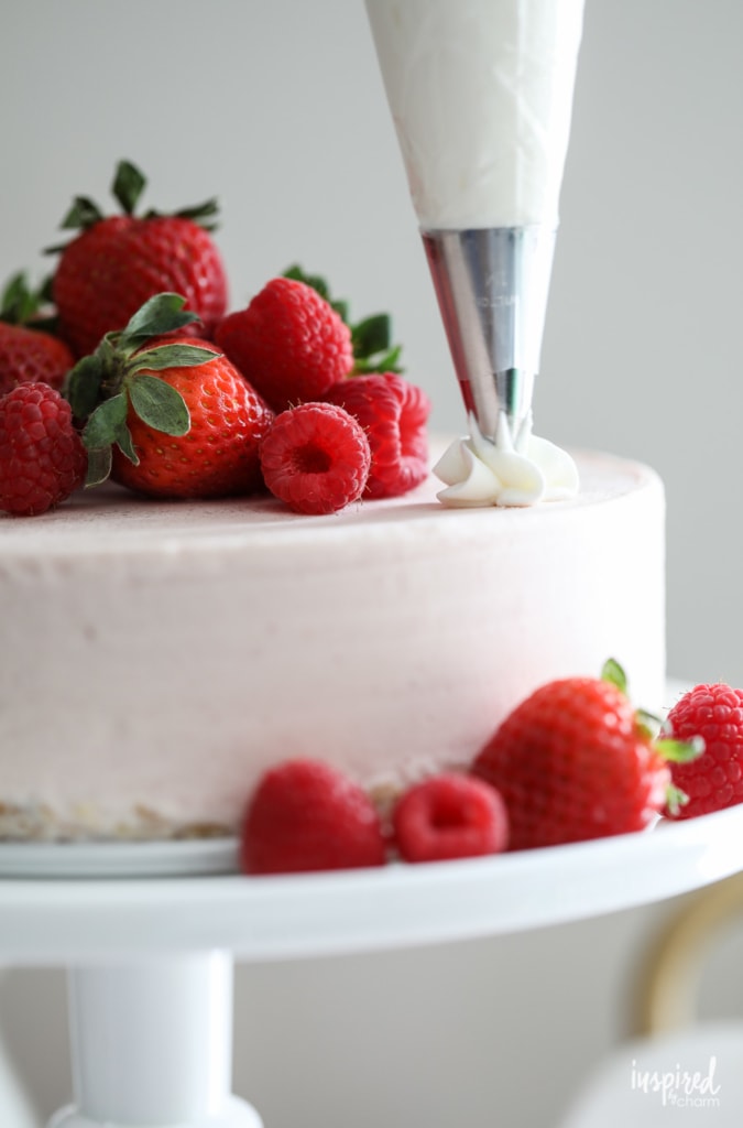 This Strawberry Ice Cream Cheesecake is a delicious summer dessert recipe. #summer #strawberry #cake #cheesecake #icecream #recipe #dessert