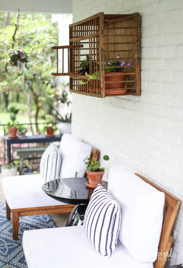 a front porch with white and blue furnishings