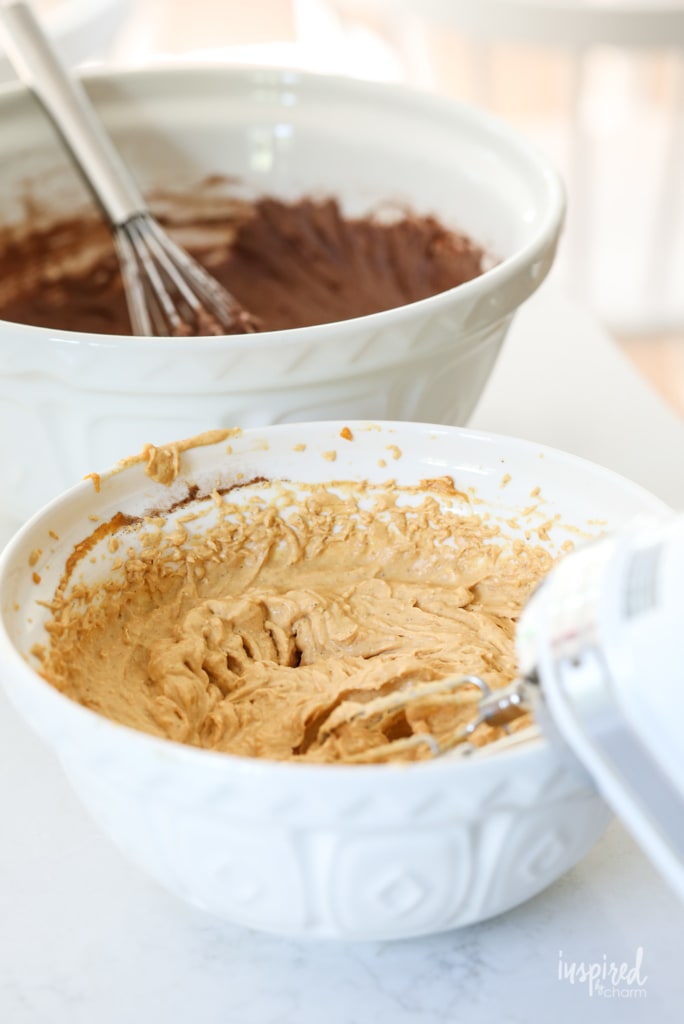These Pumpkin Cheesecake Brownies are the perfect fall dessert! #pumpkin #brownies #pumpkinspice #fall #baking #dessert #recipe