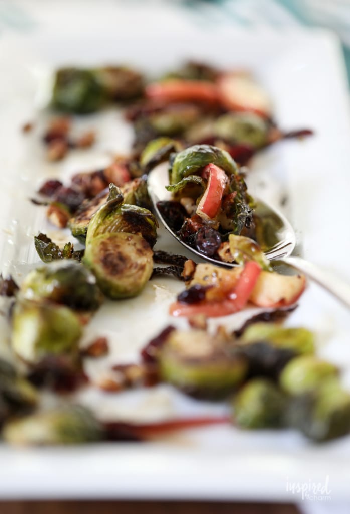 These Roasted Brussels Sprouts with apple, cranberries, and pecans make a tasty fall side dish. #sidedish #fall #recipe #roasted #brusselssprouts #apple #cranberries