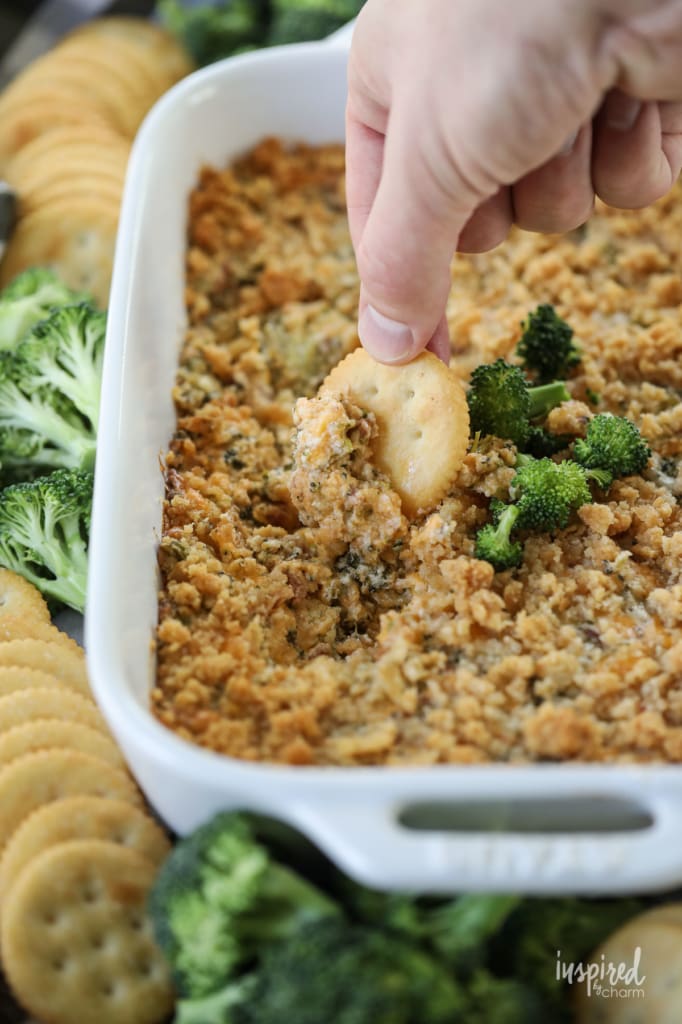 ritz cracker scooping up crumbly broccoli cheese casserole 