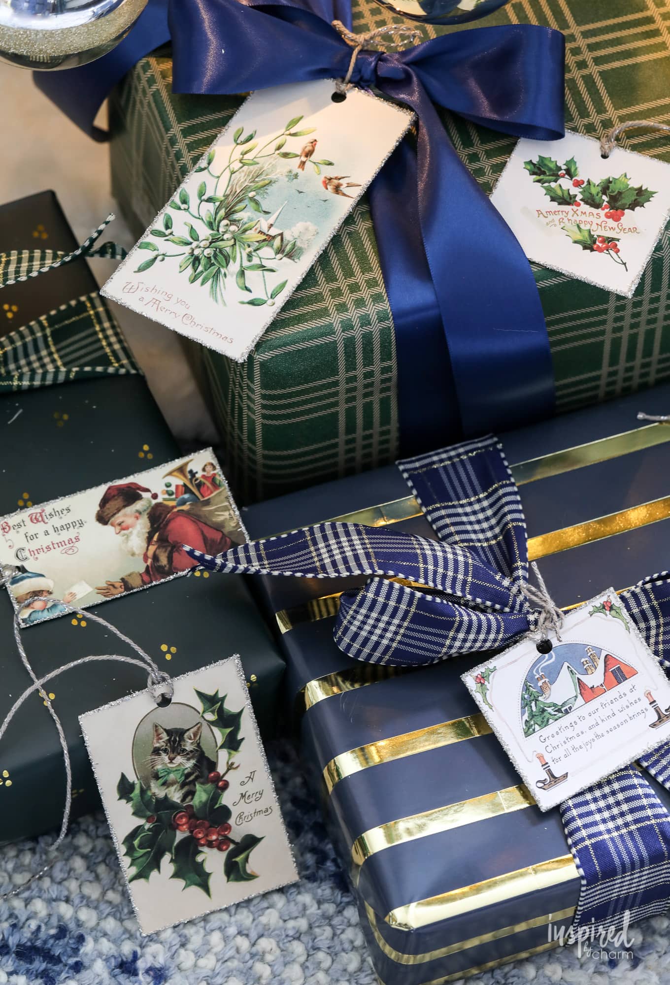 blue and green wrapped christmas presents with vintage gift tags.