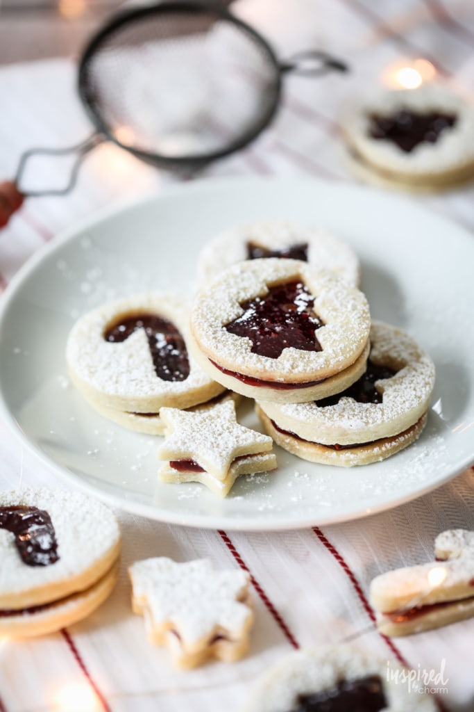jam filled Christmas cookies with festive cutouts